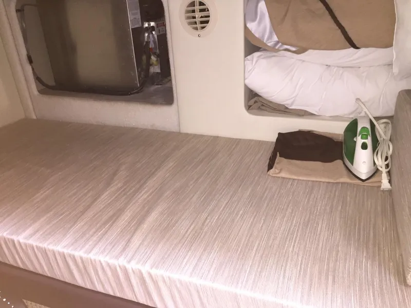 Slide: The Image of Interior of 2013 Meridian 341 Sedan with bed, iron, and storage space. - 34