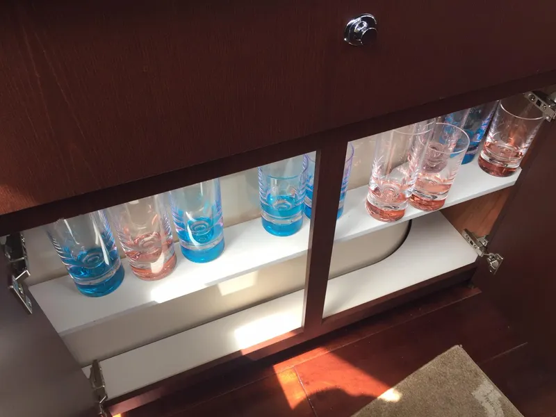 Slide: The Image of Cabinet with colorful glasses inside a 2013 Meridian 341 Sedan yacht. - 37