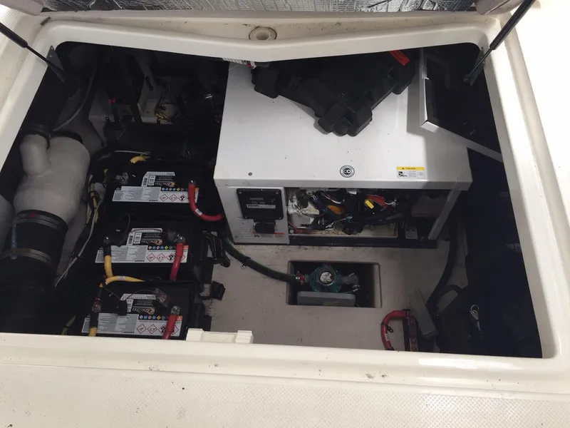 Slide: The Image of Engine compartment of a 2013 Meridian 341 Sedan with visible batteries and equipment. - 48