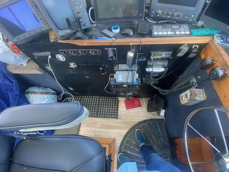 Slide: The Image of 1945 Higgins PT boat cockpit with navigation and communication equipment. - 10