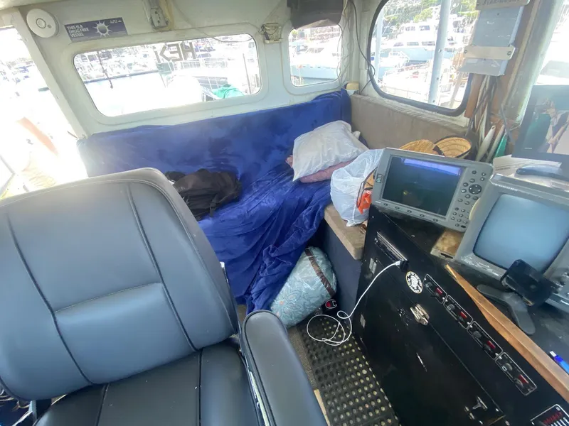 Slide: The Image of Interior of a 1945 Higgins PT boat with navigation equipment and seating. - 12