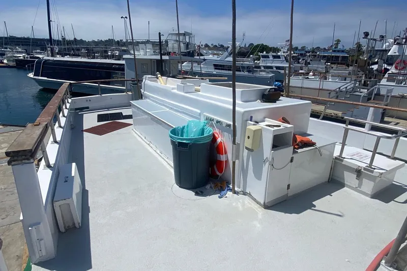 Slide: The Image of 1945 Higgins PT boat docked at marina, featuring deck and equipment. - 7