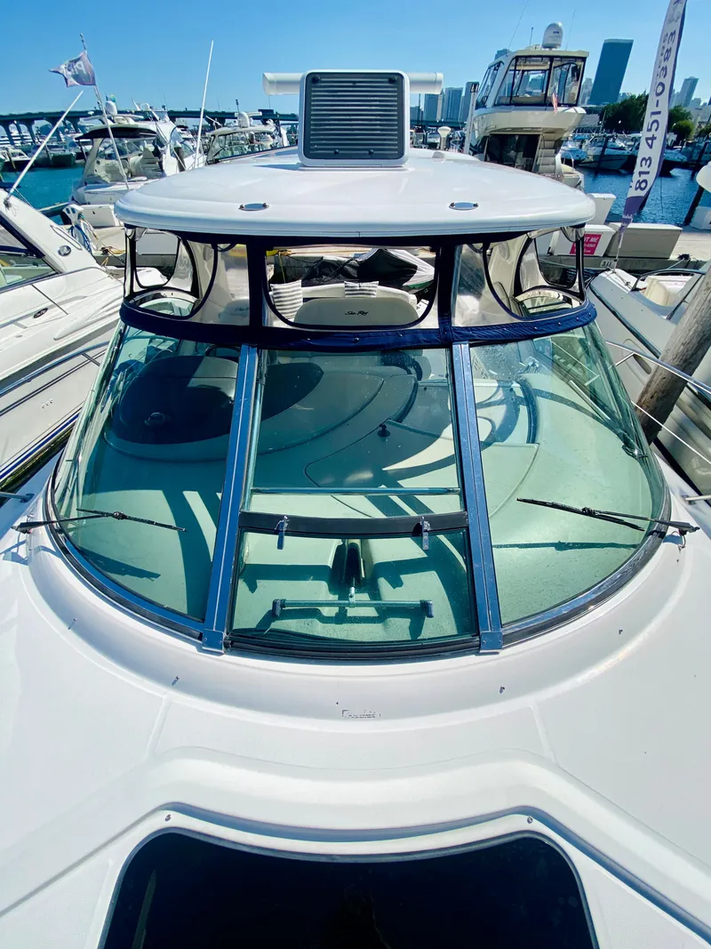 Slide: The Image of 2007 Sea Ray 44 Sundancer yacht docked at a marina. - 11