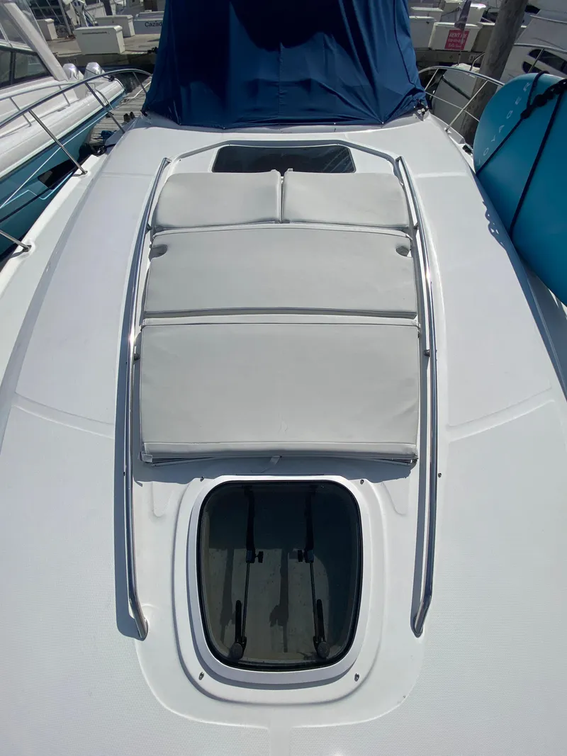 Slide: The Image of 2007 Sea Ray 44 Sundancer yacht with sunpad and hatch on deck. - 13