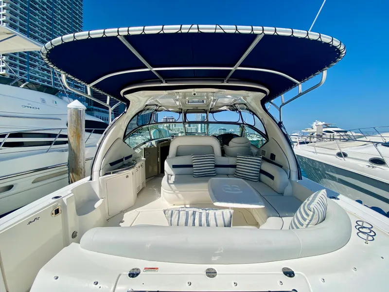 Slide: The Image of 2007 Sea Ray 44 Sundancer yacht with spacious seating and blue canopy. - 19