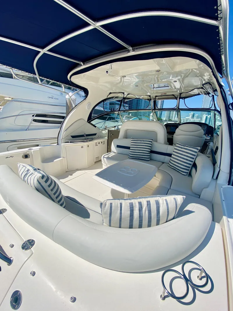 Slide: The Image of 2007 Sea Ray 44 Sundancer yacht with spacious seating and striped cushions. - 20