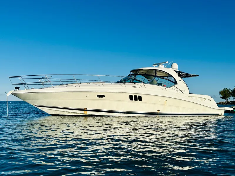 Slide: The Image of 2007 Sea Ray 44 Sundancer yacht on calm water. - 3