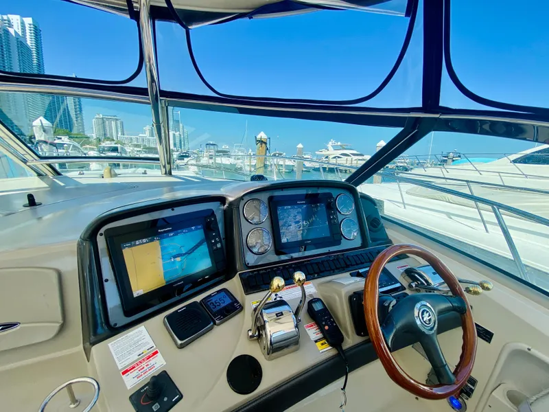 Slide: The Image of Helm of 2007 Sea Ray 44 Sundancer with modern navigation equipment. - 31