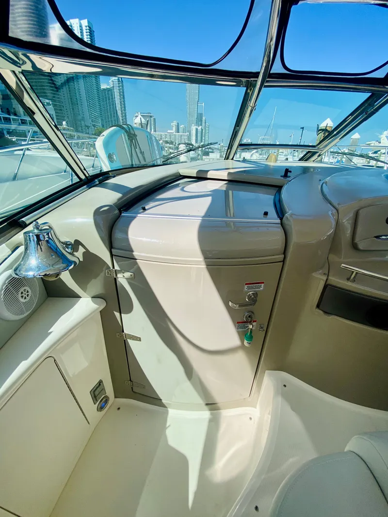 Slide: The Image of 2007 Sea Ray 44 Sundancer helm with city skyline in background. - 34