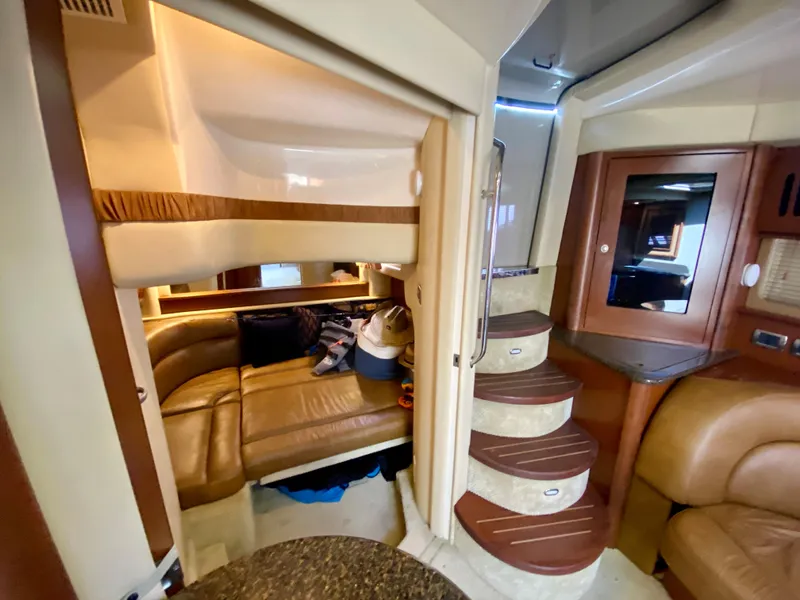 Slide: The Image of Interior of 2007 Sea Ray 44 Sundancer yacht with leather seating and wooden stairs. - 40