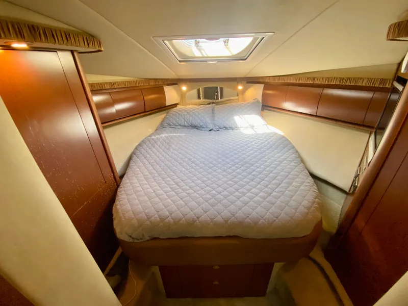 Slide: The Image of Luxurious bedroom in 2007 Sea Ray 44 Sundancer yacht with skylight and cozy bedding. - 46