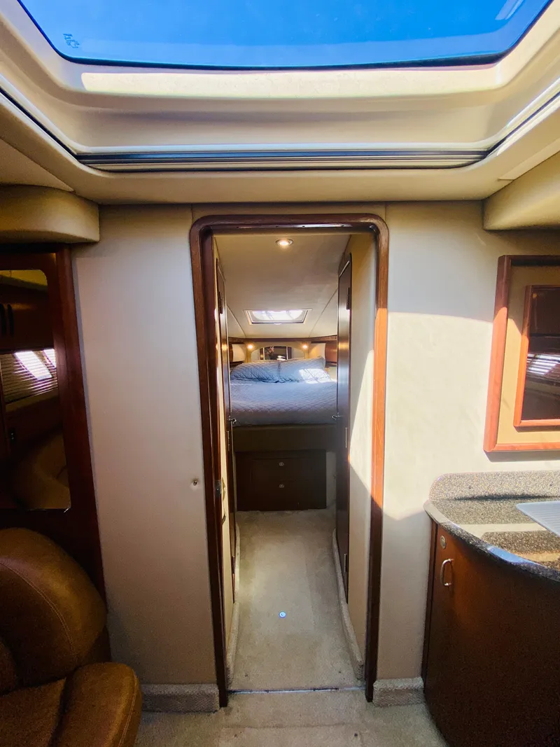 Slide: The Image of 2007 Sea Ray 44 Sundancer interior cabin with skylight and bedroom view. - 48