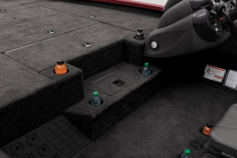 Slide: The Image of 2024 Tracker Pro Team™ 195 TXW Tournament Edition boat interior with cup holders and storage compartments. - 14