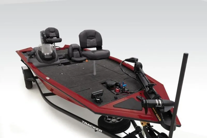 Slide: The Image of 2024 Tracker Pro Team™ 195 TXW Tournament Edition fishing boat, red, with dual seats and advanced equipment. - 32