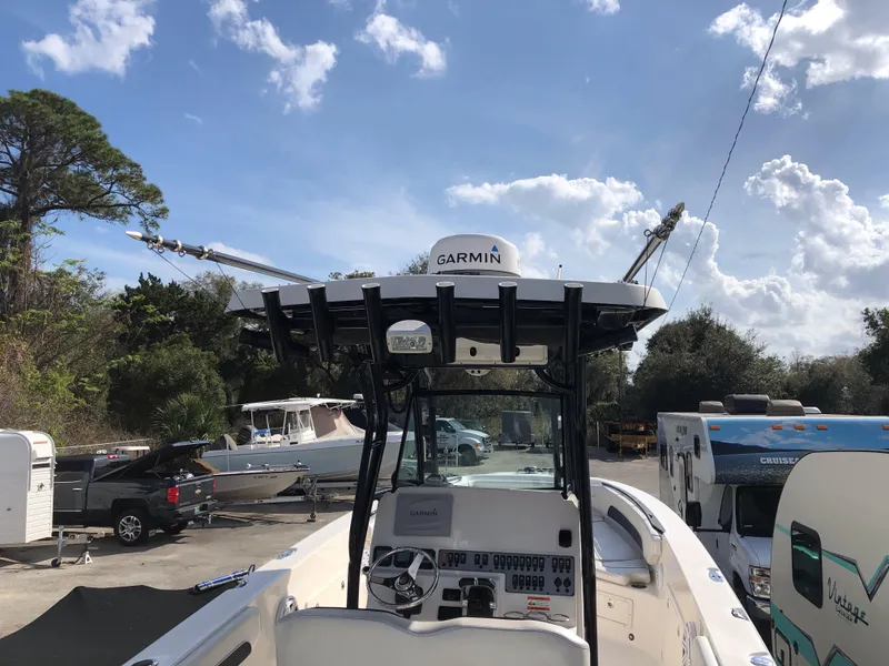 Slide: The Image of 2016 Wellcraft 30 Scarab Offshore Tournament boat with Garmin electronics, docked under a sunny sky. - 11