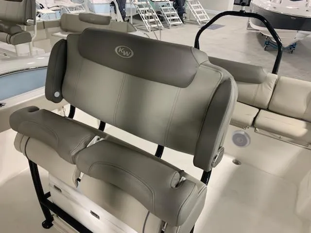 Slide: The Image of 2024 Key West 239 FS boat interior seating in showroom. - 3