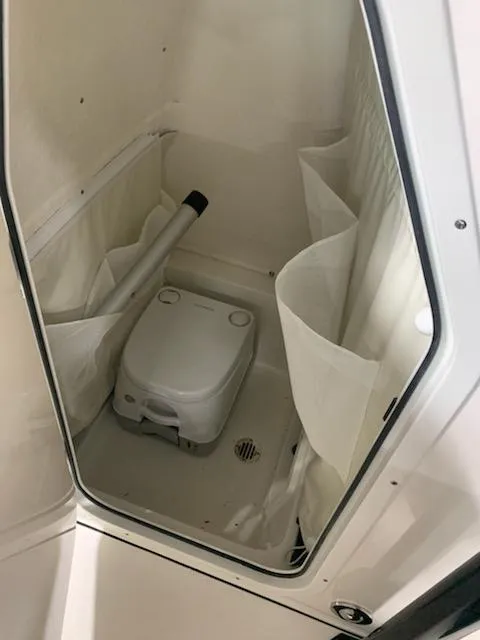 Slide: The Image of 2024 Key West 239 FS boat interior with portable toilet - 4