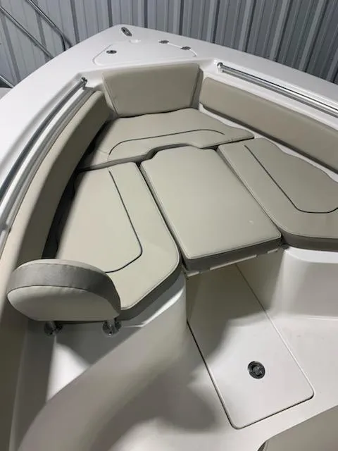 Slide: The Image of 2024 Key West 239 FS boat with cushioned seating in the bow area. - 5