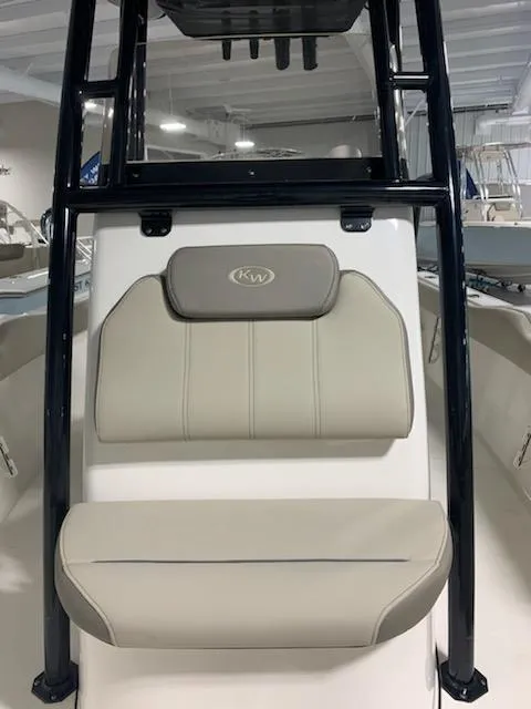 Slide: The Image of 2024 Key West 239 FS boat with beige seating and black frame. - 6