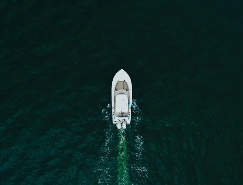 Slide: The Image of Aerial view of 2024 Key West 239 FS boat cruising on dark water. - 9