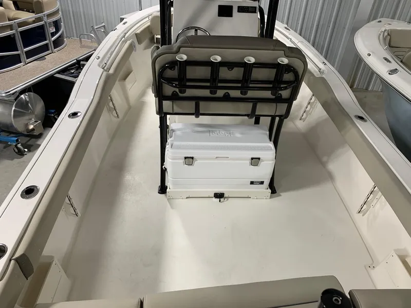 Slide: The Image of 2024 Key West 239 FS boat interior with cooler and seating. - 4