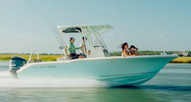 Slide: The Image of 2024 Key West 239 FS boat cruising on water with passengers. - 8