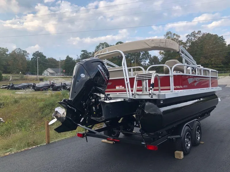 Slide: The Image of 2023 Ranger 200C pontoon boat on trailer with outboard motor. - 5