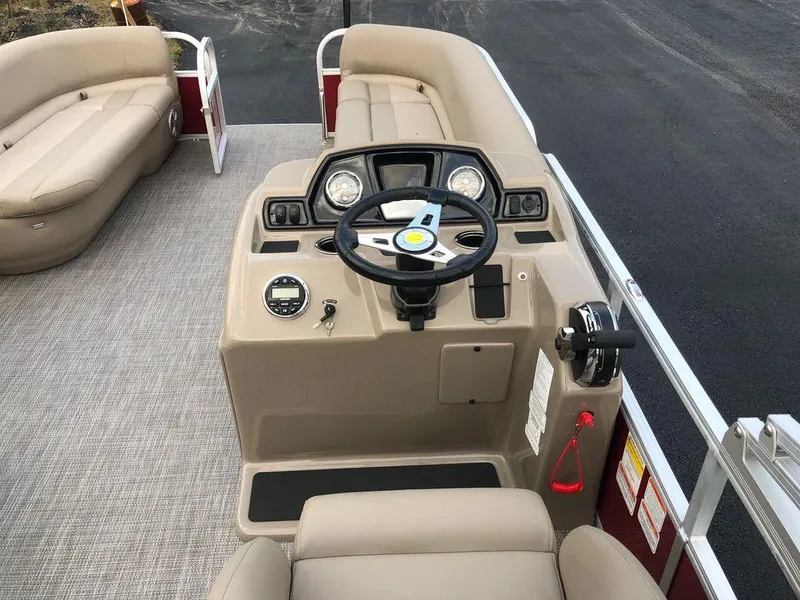 Slide: The Image of 2023 Ranger 200C boat interior with steering console and seating. - 7