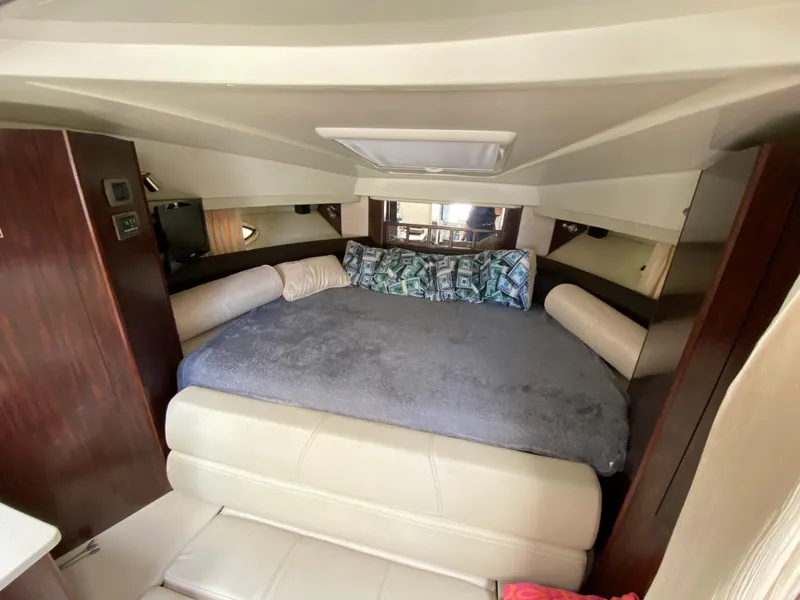 Slide: The Image of Interior cabin of 2014 Monterey 320 Sport Yacht with cozy bed and seating. - 10