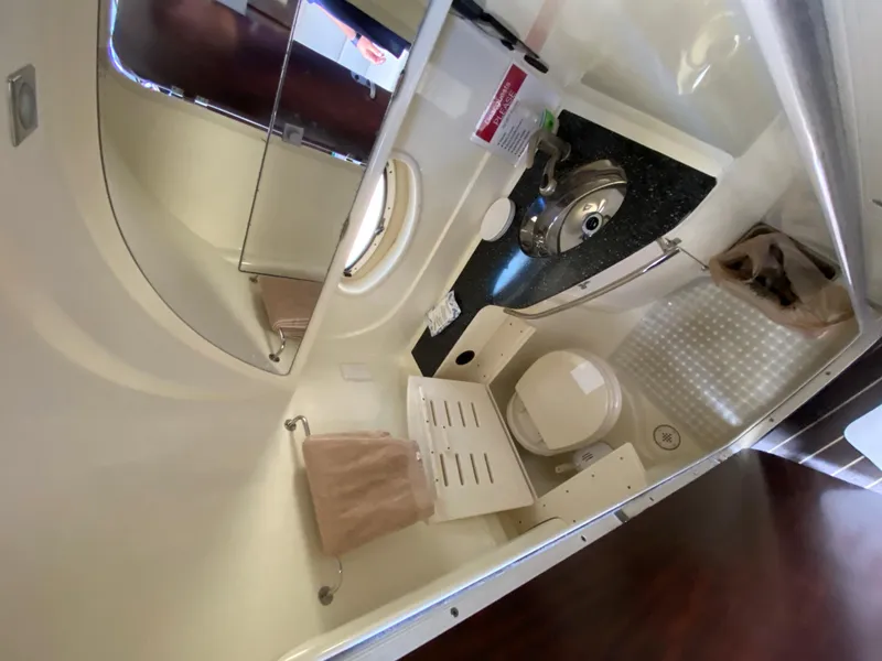 Slide: The Image of 2014 Monterey 320 Sport Yacht bathroom with sink, toilet, and mirror. - 11