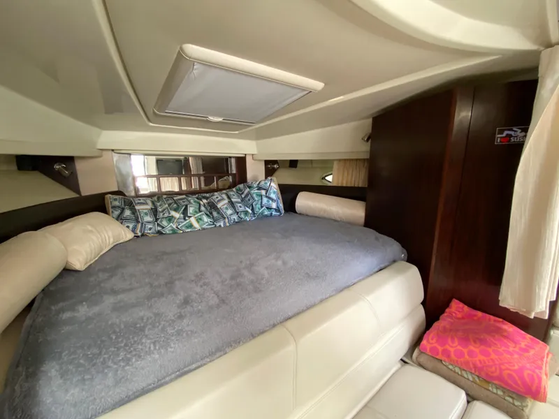 Slide: The Image of Luxurious cabin interior of a 2014 Monterey 320 Sport Yacht with a cozy bed. - 12
