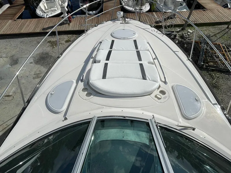 Slide: The Image of 2014 Monterey 320 Sport Yacht bow deck with sunpad and railings. - 13