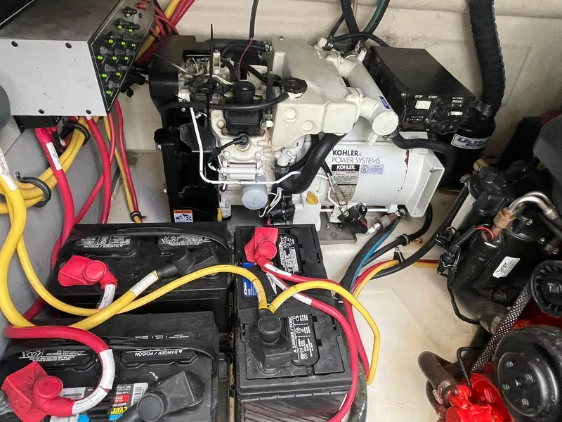 Slide: The Image of Engine compartment of a 2014 Monterey 320 Sport Yacht with Kohler power system and batteries. - 14