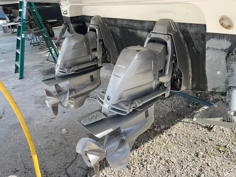 Slide: The Image of 2014 Monterey 320 Sport Yacht dual outboard motors in a boatyard. - 16