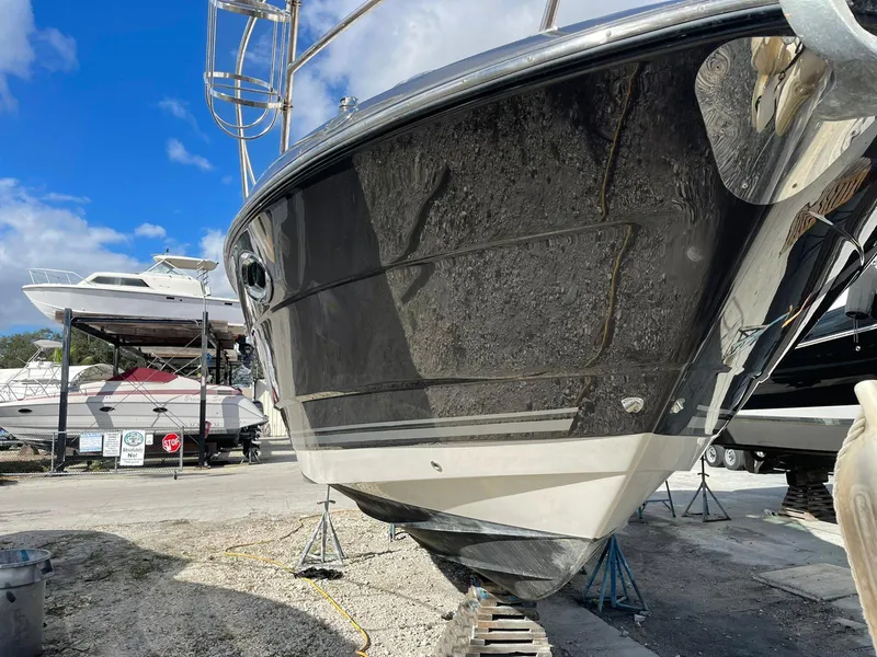 Slide: The Image of 2014 Monterey 320 Sport Yacht on dry dock, front view. - 20