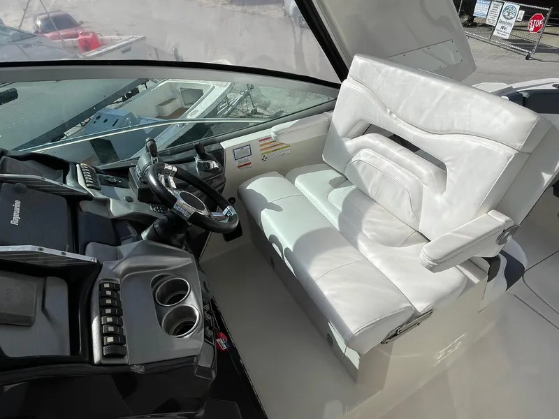 Slide: The Image of Cockpit of 2014 Monterey 320 Sport Yacht with white leather seating and modern controls. - 24