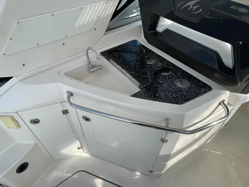 Slide: The Image of 2014 Monterey 320 Sport Yacht kitchenette with sink and countertop. - 26