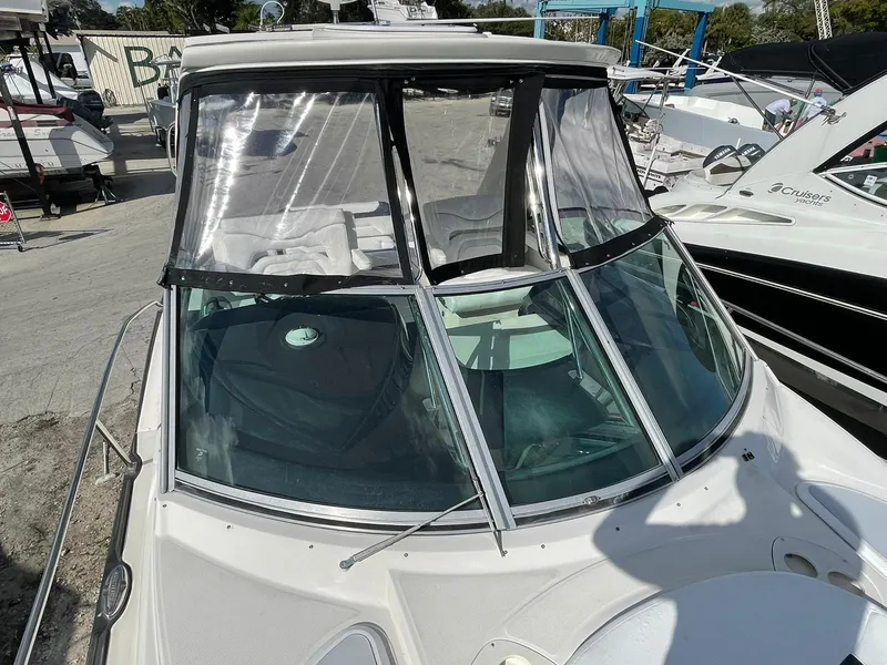 Slide: The Image of 2014 Monterey 320 Sport Yacht with clear windshield and cockpit cover. - 31