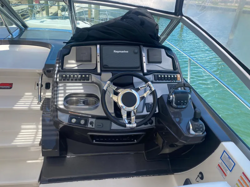 Slide: The Image of Helm of 2014 Monterey 320 Sport Yacht with Raymarine electronics. - 8