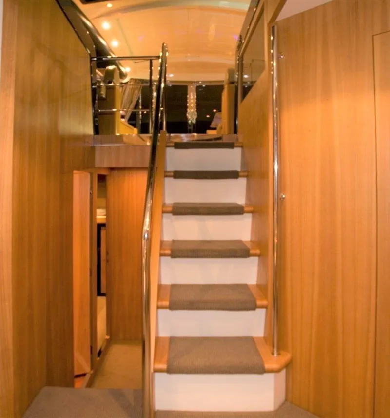 Slide: The Image of Interior staircase of 2004 Riva Splendida yacht with wooden paneling. - 12