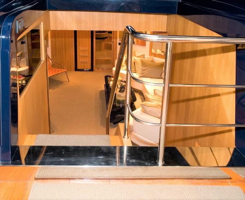 Slide: The Image of Interior of 2004 Riva Splendida yacht with modern furnishings and wooden paneling. - 5