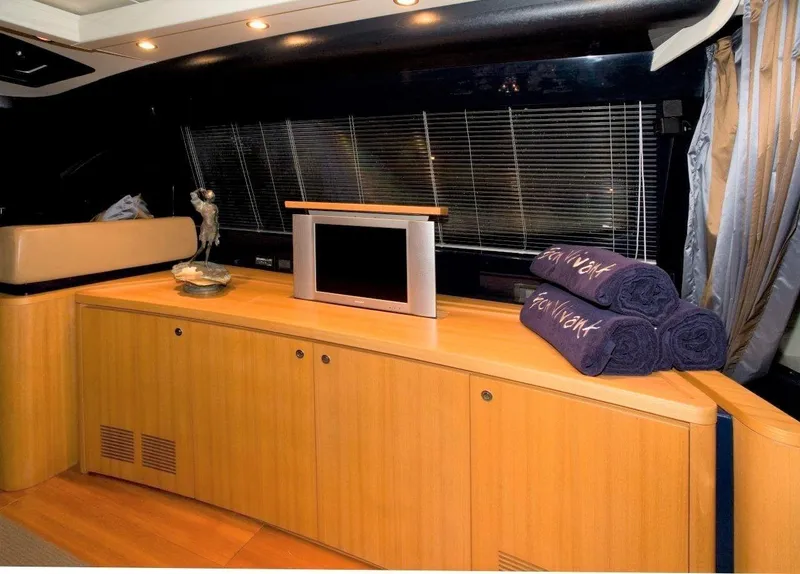 Slide: The Image of Luxurious interior of 2004 Riva Splendida yacht with TV and folded towels. - 8