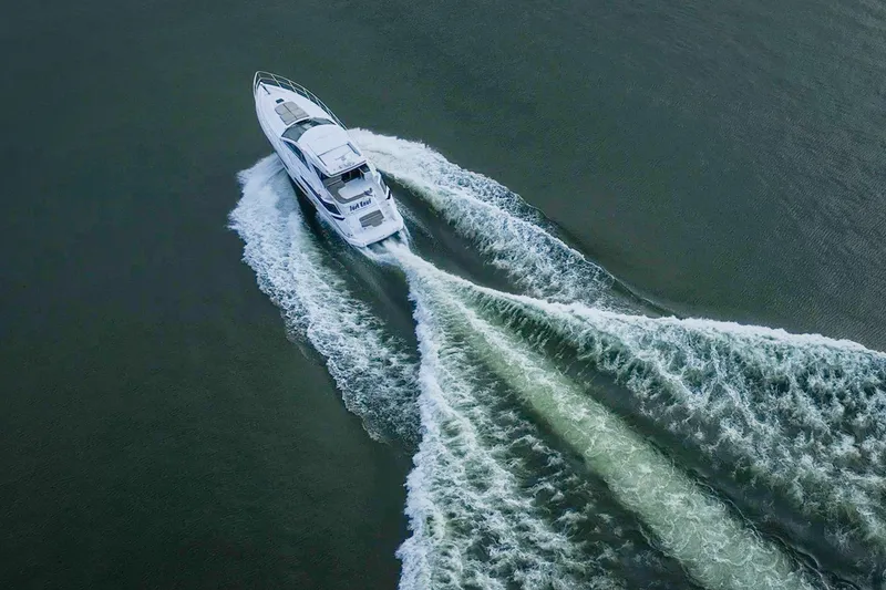 Slide: The Image of Aerial view of 2015 Regal 53 Sport Coupe yacht cruising on open water. - 21