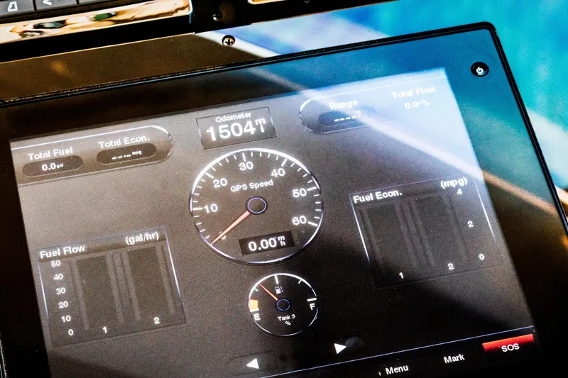Slide: The Image of Dashboard display of a 2015 Regal 53 Sport Coupe showing odometer and fuel metrics. - 26