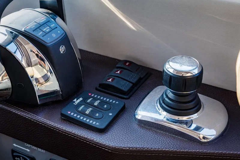 Slide: The Image of Control panel of 2015 Regal 53 Sport Coupe with joystick and throttle controls. - 28