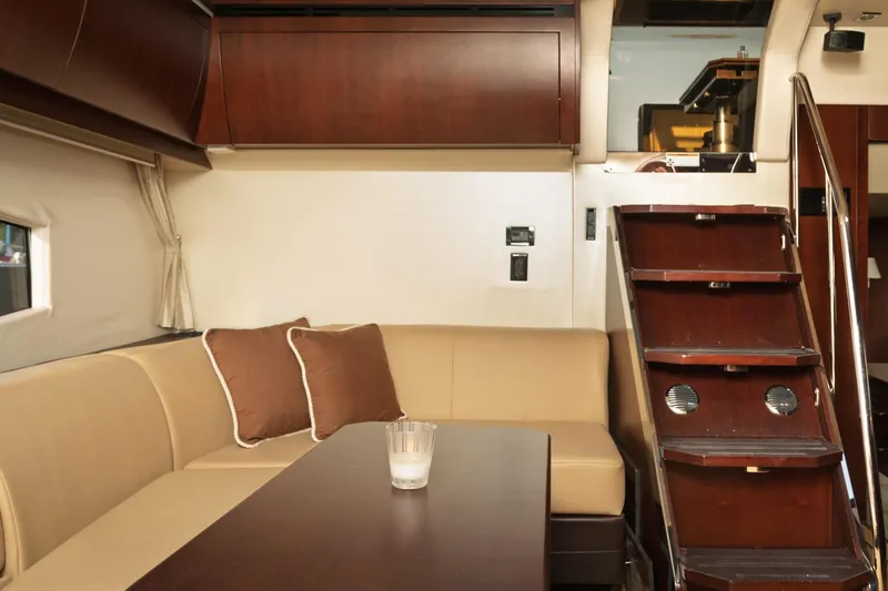 Slide: The Image of Luxurious interior of 2015 Regal 53 Sport Coupe with elegant seating and wooden stairs. - 29