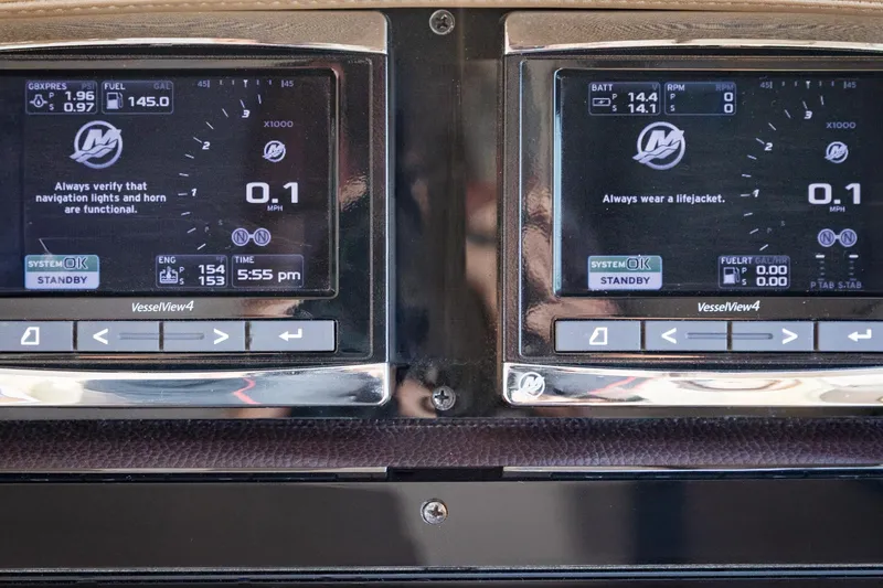 Slide: The Image of Dashboard of a 2015 Regal 53 Sport Coupe with VesselView4 displays. - 30