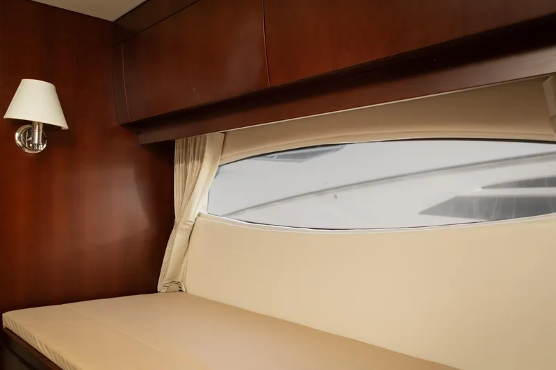 Slide: The Image of Luxurious interior of 2015 Regal 53 Sport Coupe yacht with elegant wood finish. - 32