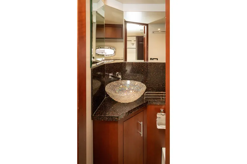 Slide: The Image of Luxurious bathroom in 2015 Regal 53 Sport Coupe yacht with glass vessel sink. - 37