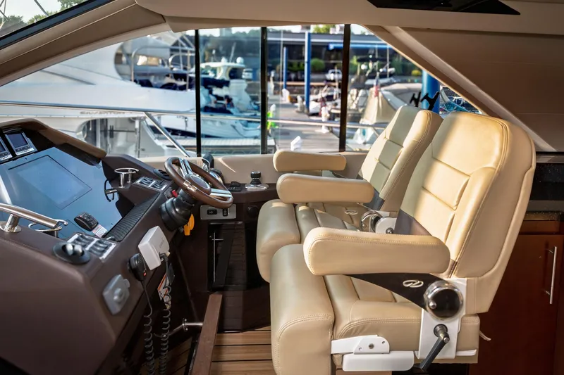 Slide: The Image of Interior of 2015 Regal 53 Sport Coupe yacht with luxurious leather seating and modern controls. - 40
